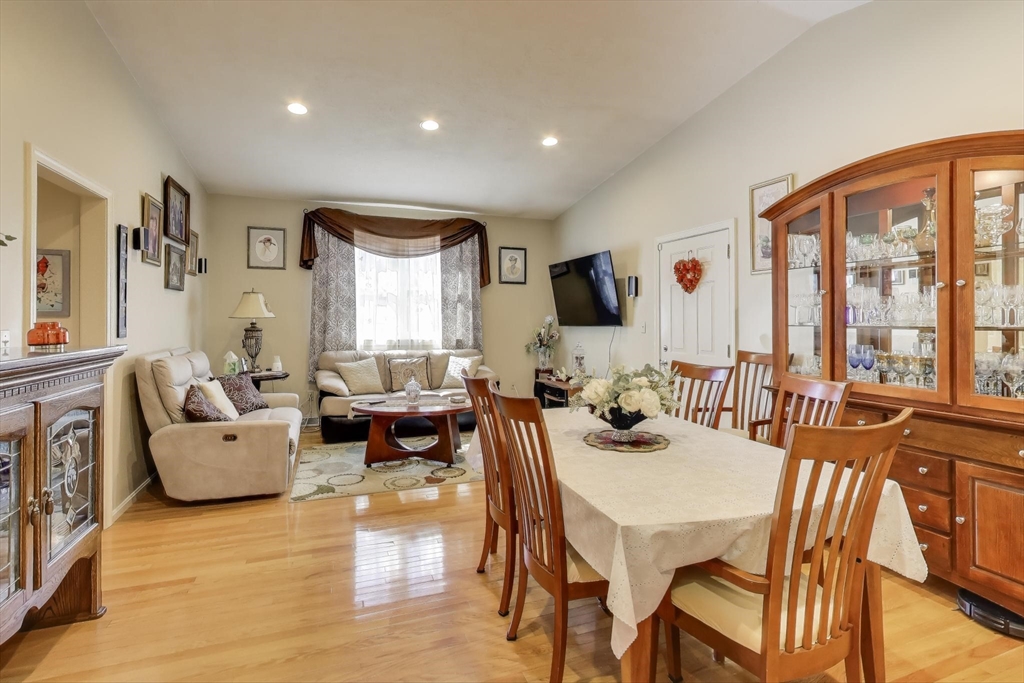 425 Main Street, Unit 11B Hudson, MA 01749 - Photo 9 of 26 a living room with fireplace furniture and a flat screen tv
