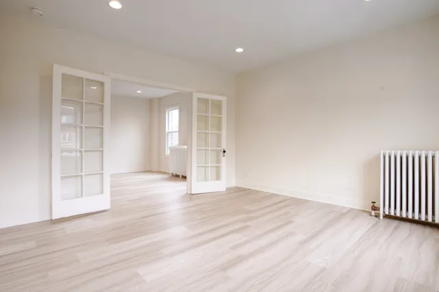 a view of a kitchen with a sink a washer and dryer
