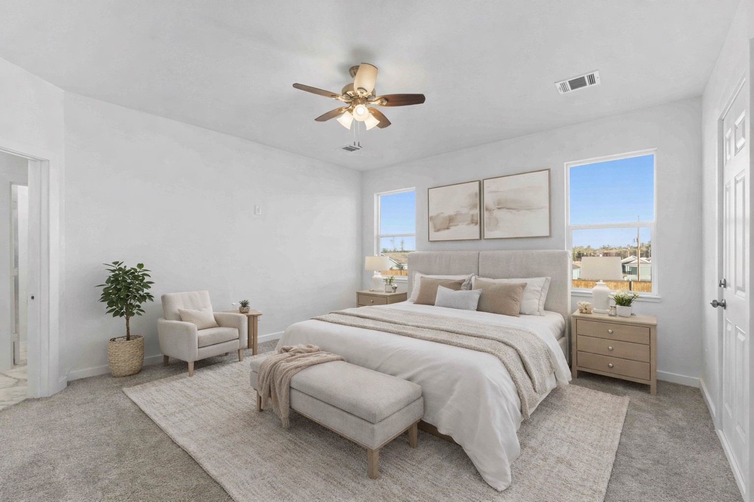 18611 Ratho Drive Conroe, TX 77306 - Photo 12 of 28 a bedroom with a bed and a chandelier