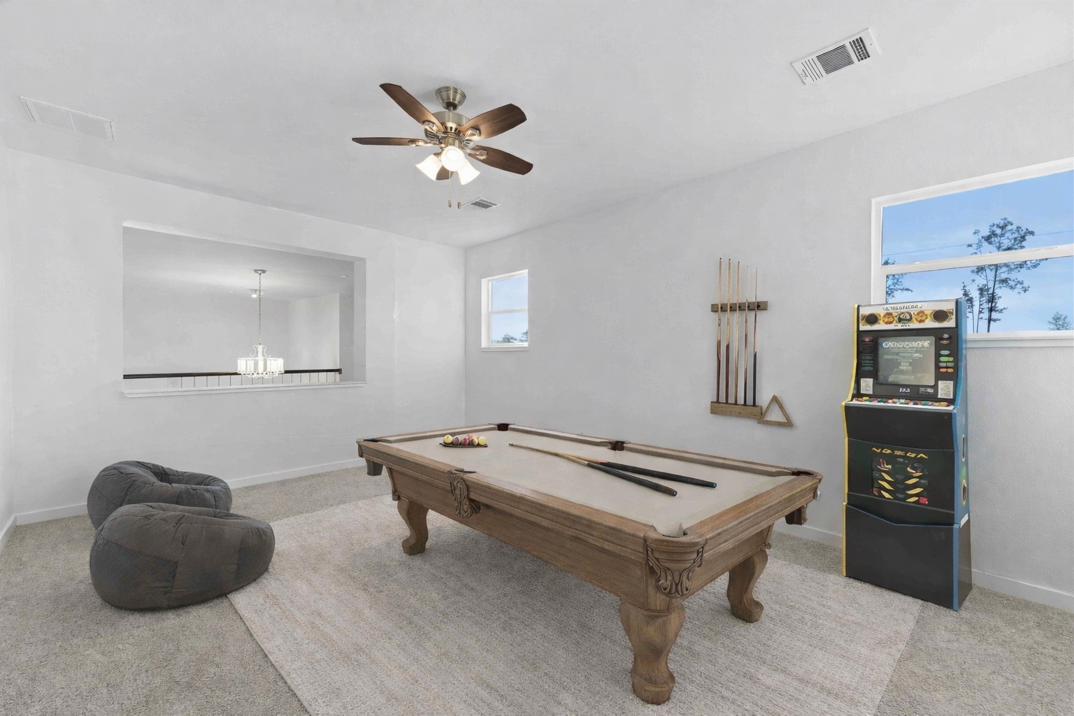 18611 Ratho Drive Conroe, TX 77306 - Photo 21 of 28 a living room with furniture and a table