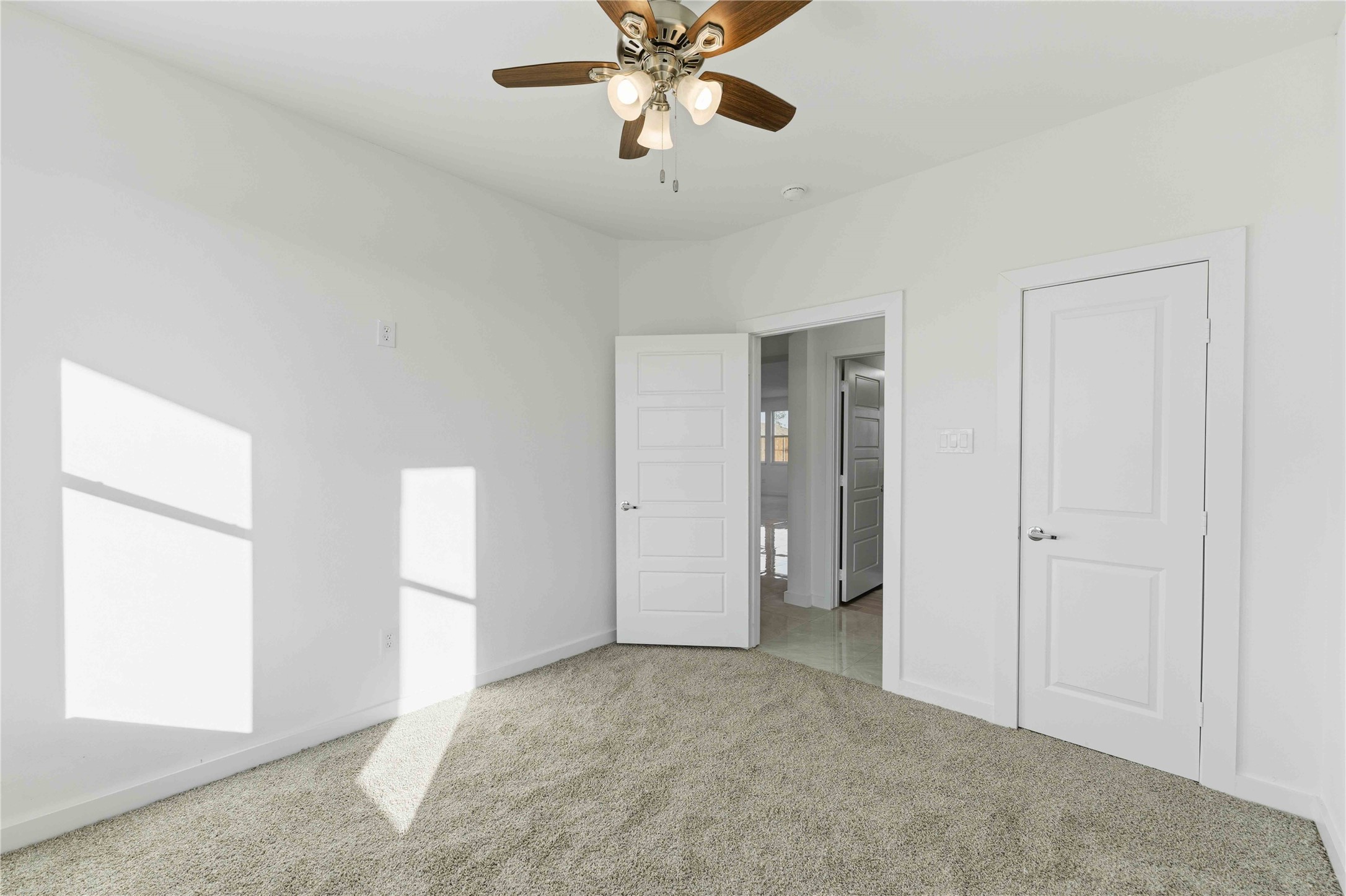 18611 Ratho Drive Conroe, TX 77306 - Photo 23 of 28 a view of a livingroom with a ceiling fan and window