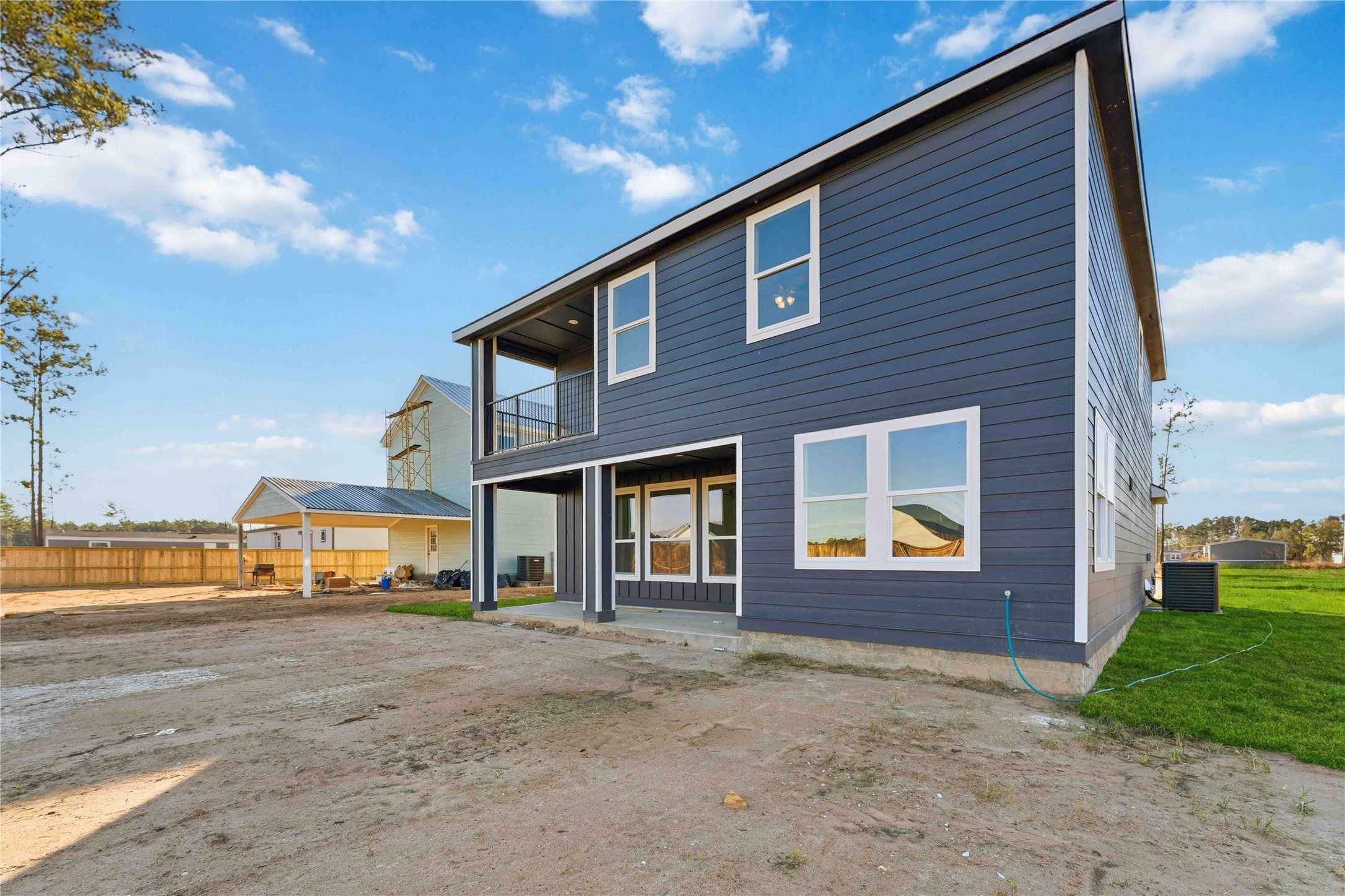 18611 Ratho Drive Conroe, TX 77306 - Photo 26 of 28 a house view with a garden space