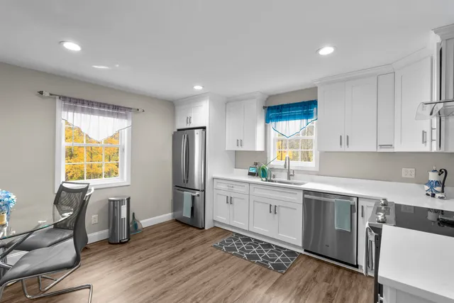a kitchen with appliances cabinets and a sink