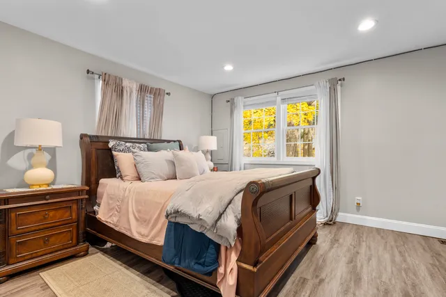 a bed room with a bed and a window