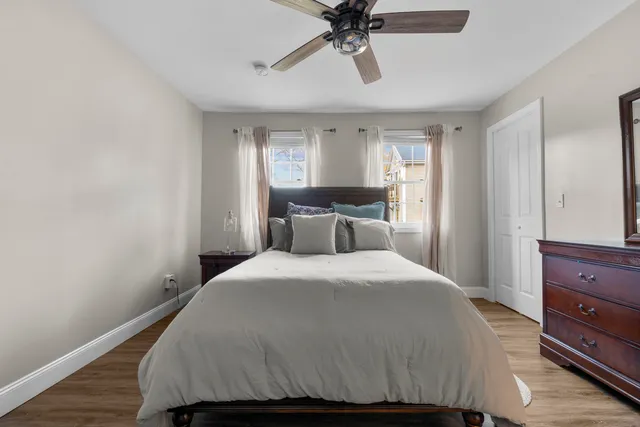 a bedroom with a bed and window