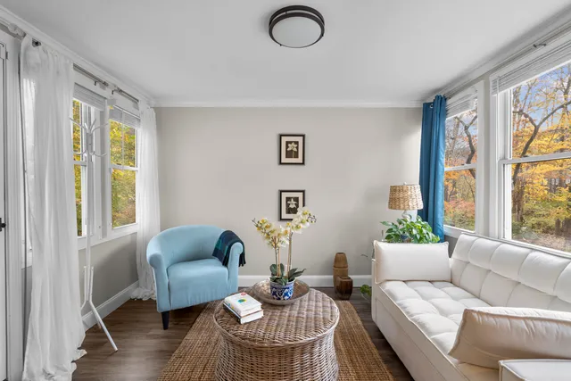 a living room with furniture and a window