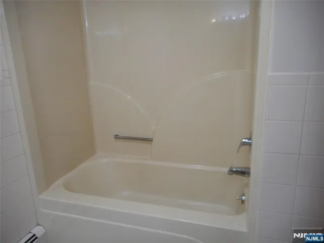 a close up of a bathtub in a bathroom