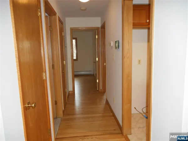 a view of a bathroom from the hallway