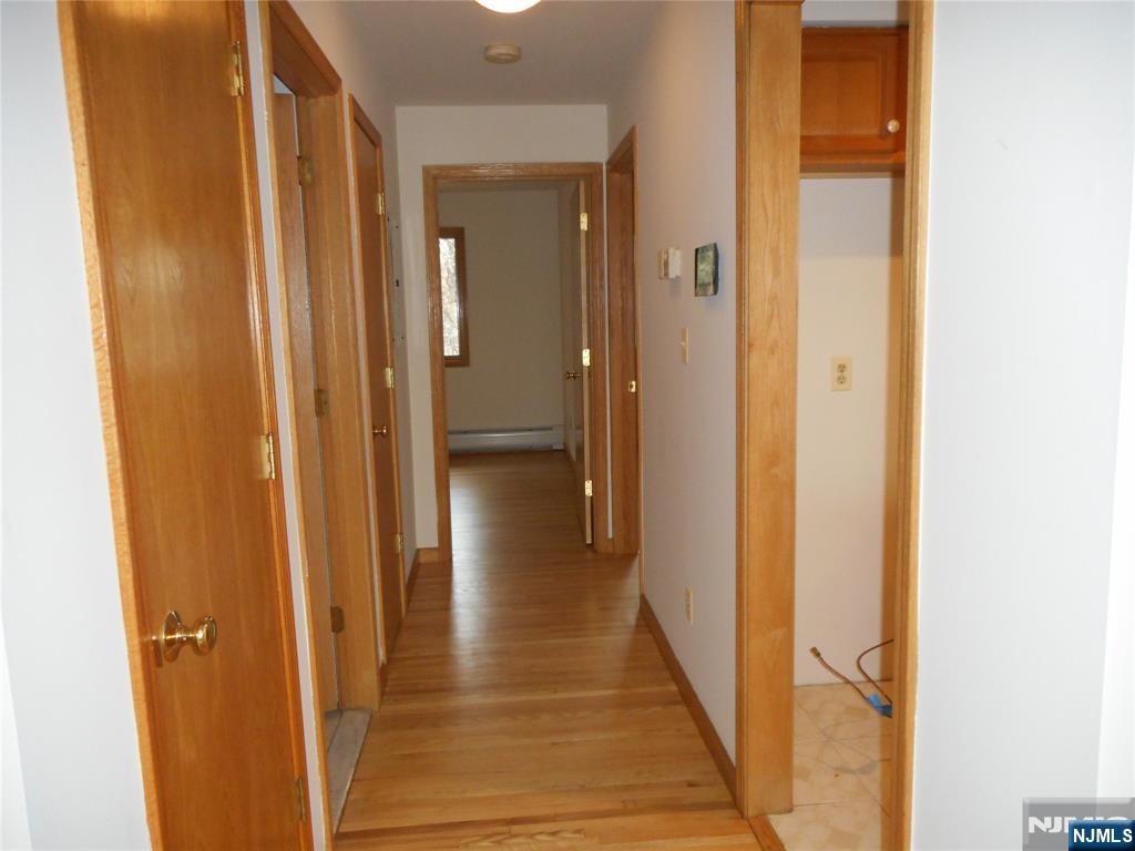 137 River Road, Unit 137 Clifton, NJ 07014 - Photo 15 of 21 a view of a bathroom from the hallway