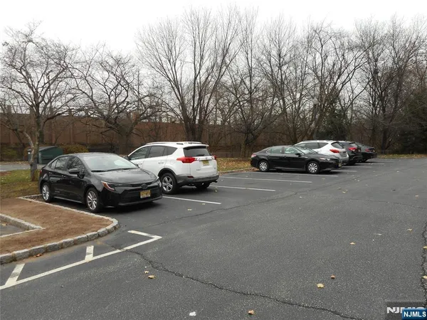 a view of street with parked cars
