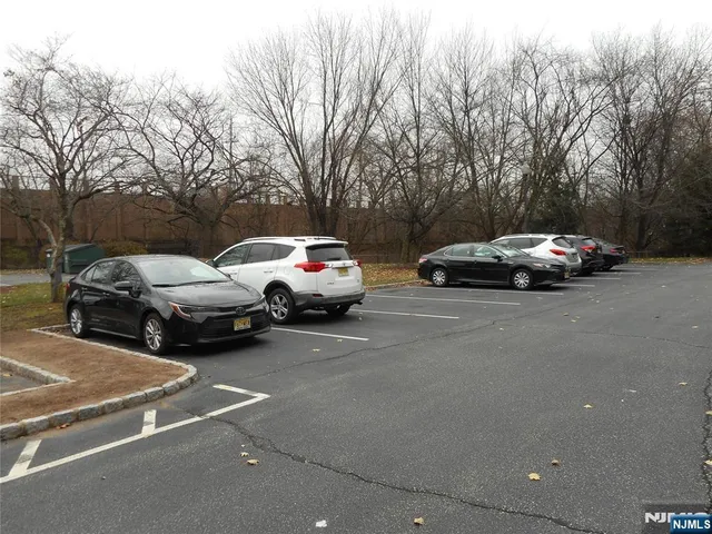 a view of street with parked cars