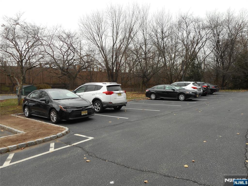 137 River Road, Unit 137 Clifton, NJ 07014 - Photo 2 of 21 a view of street with parked cars