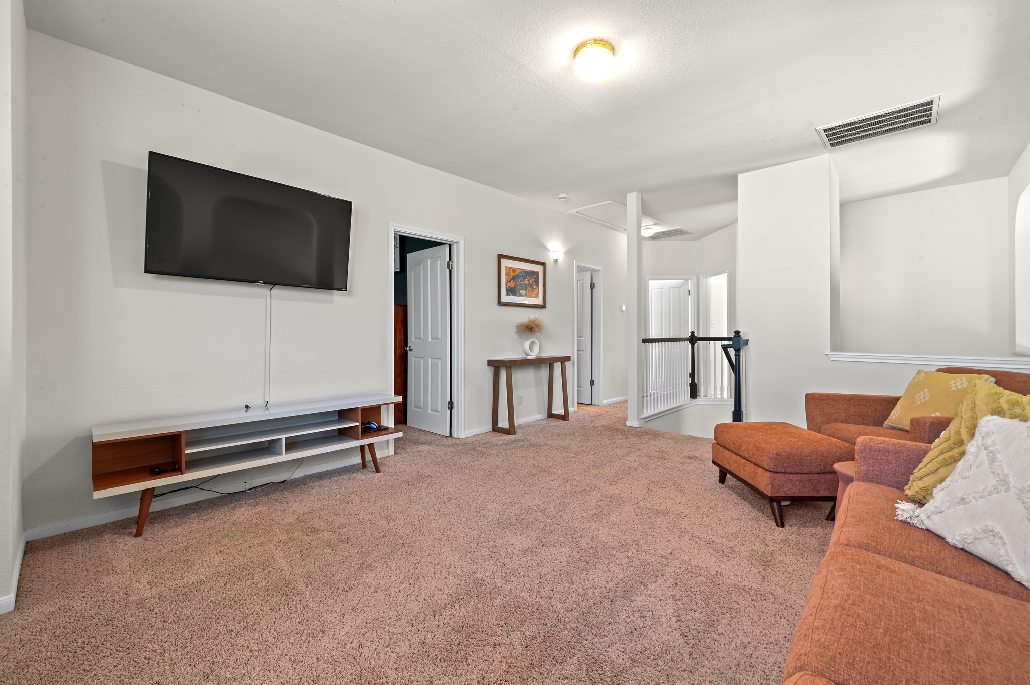 5888 Fergus Kyle, TX 78640 - Photo 20 of 40 A spacious secondary living area features soft carpeting and ample room for relaxation and entertainment.