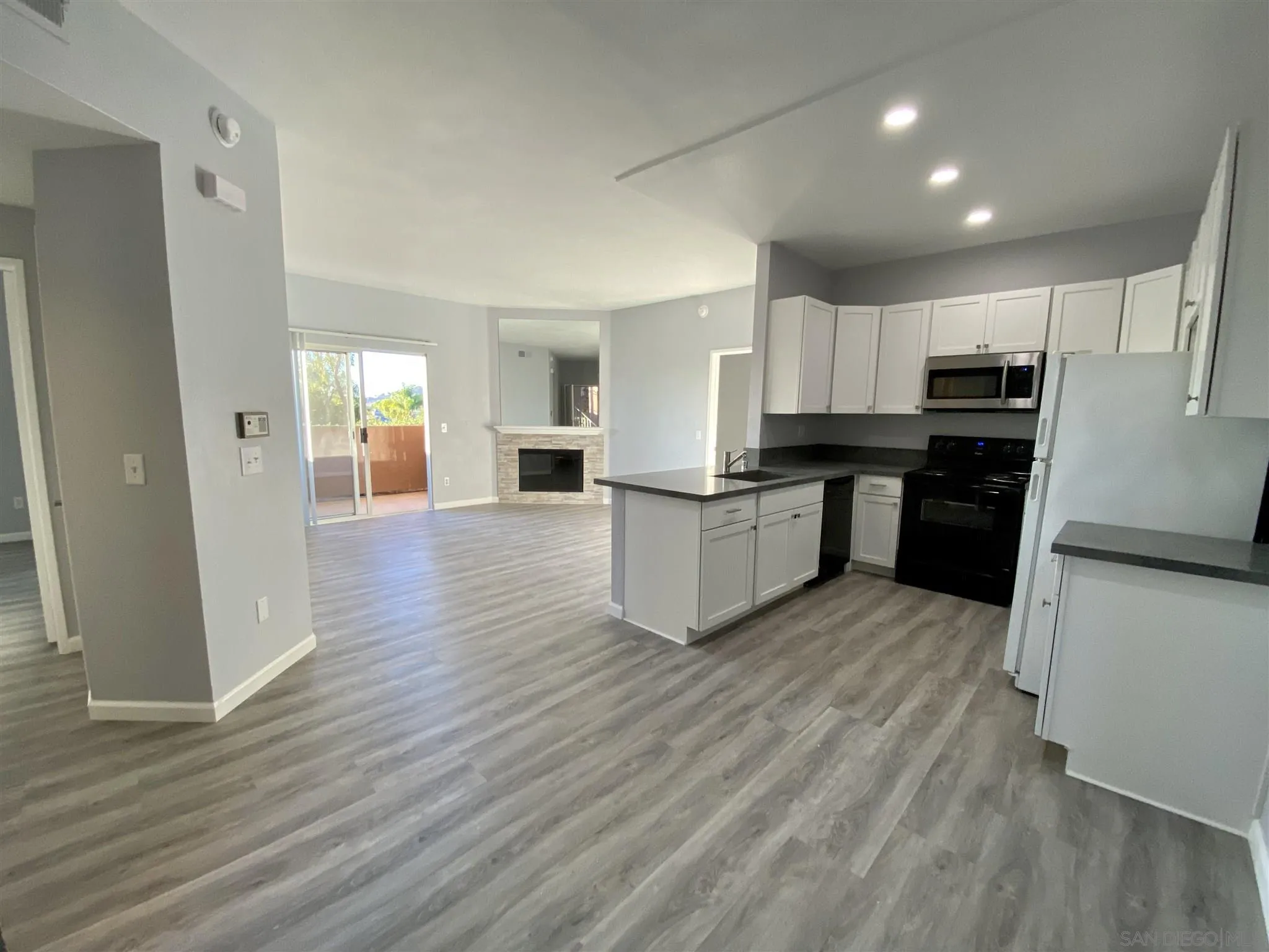 17161 Alva Road, Unit 213 San Diego, CA 92127 - Photo 1 of 48 a kitchen with stainless steel appliances a refrigerator and a stove top oven