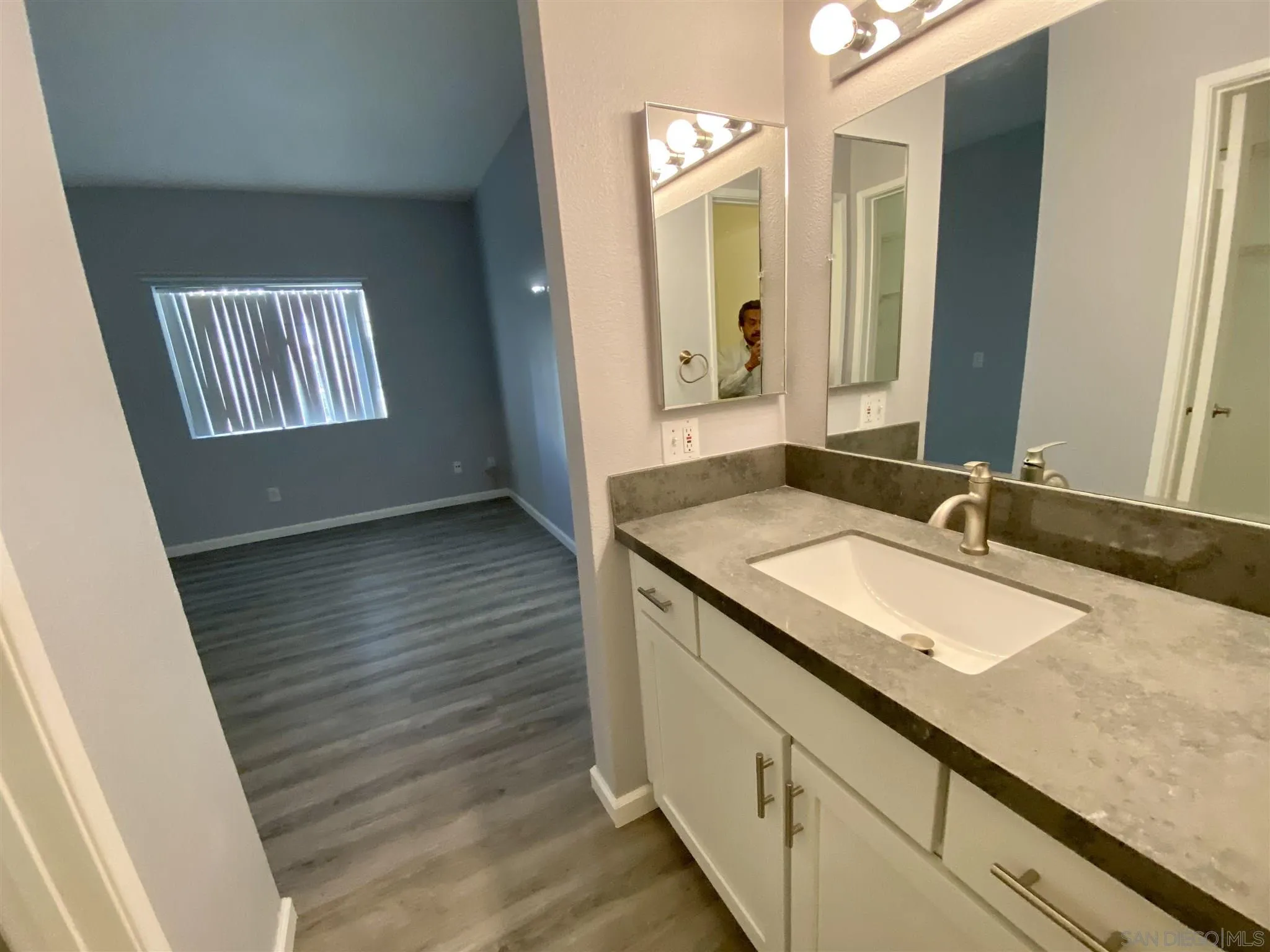 17161 Alva Road, Unit 213 San Diego, CA 92127 - Photo 16 of 48 a bathroom with a sink and a mirror