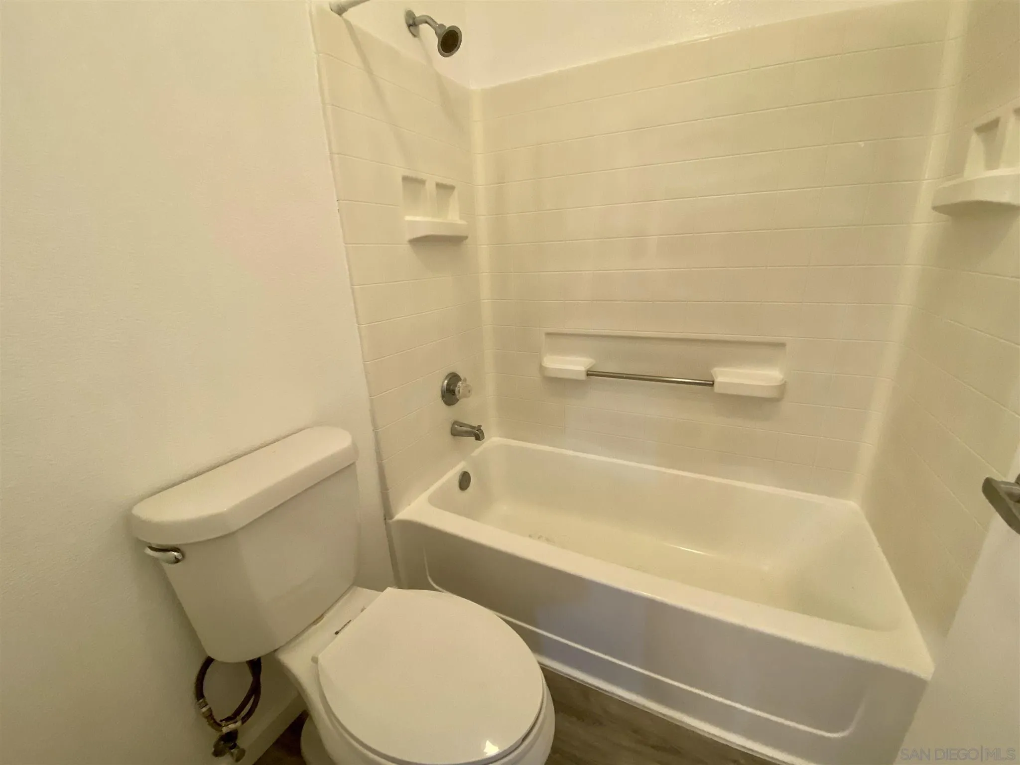 17161 Alva Road, Unit 213 San Diego, CA 92127 - Photo 19 of 48 a white toilet and tub sitting next to a bathroom sink
