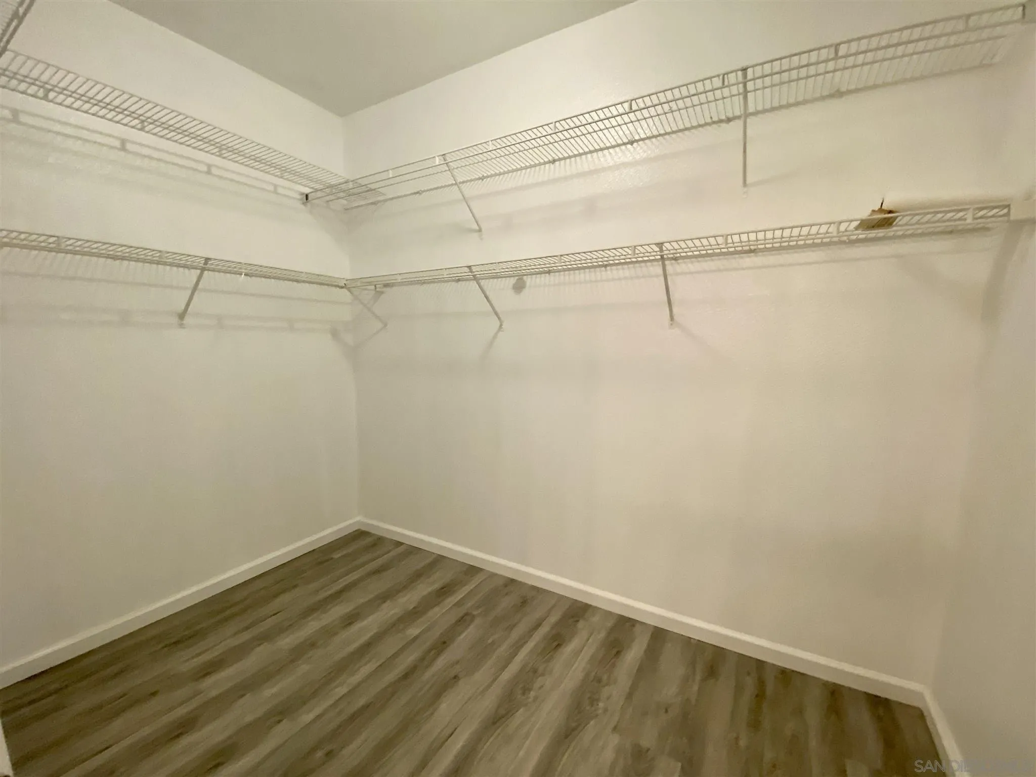 17161 Alva Road, Unit 213 San Diego, CA 92127 - Photo 20 of 48 a view of a room with racks on the wall