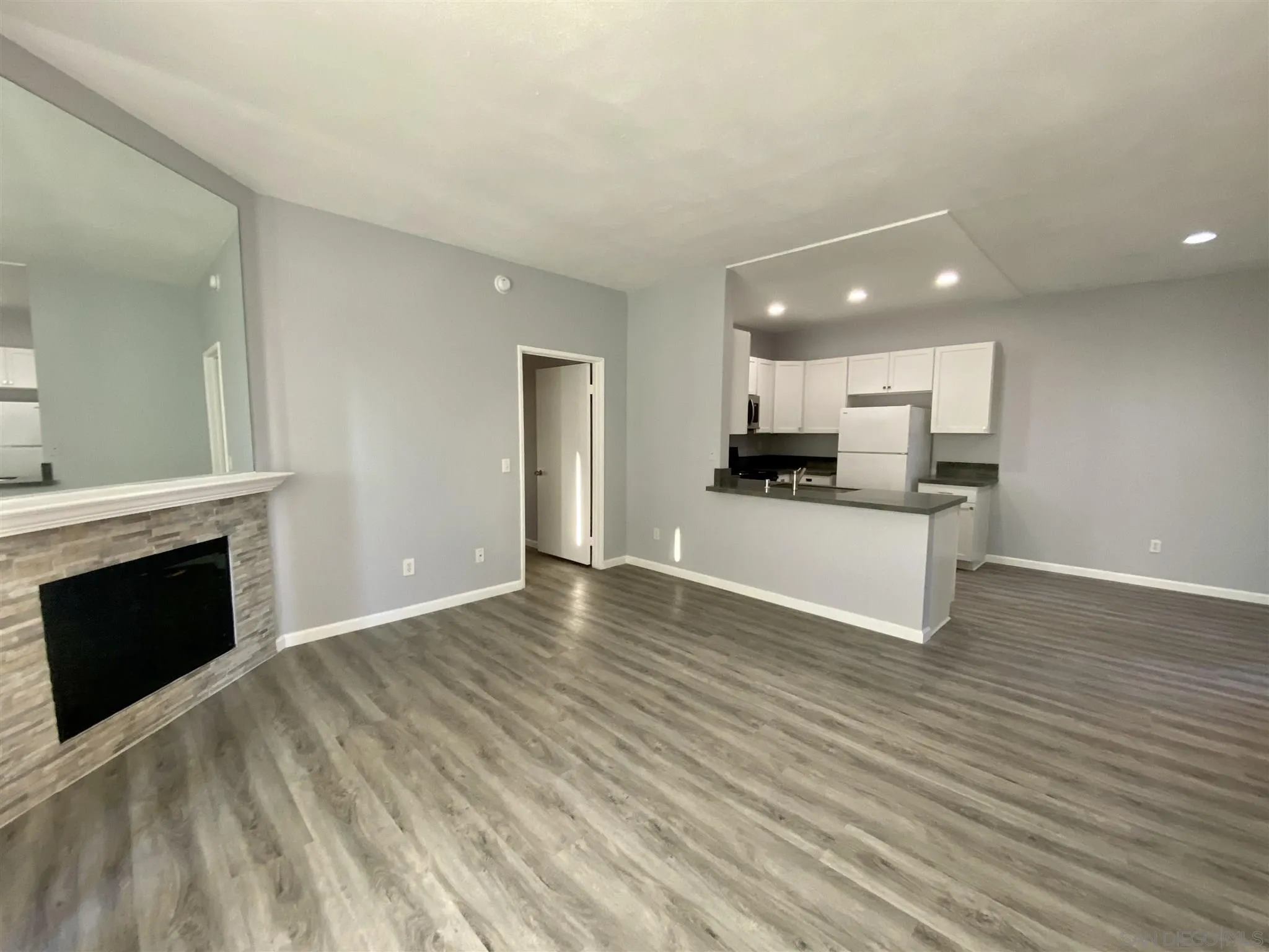 17161 Alva Road, Unit 213 San Diego, CA 92127 - Photo 2 of 48 a view of a kitchen with a sink and a fireplace