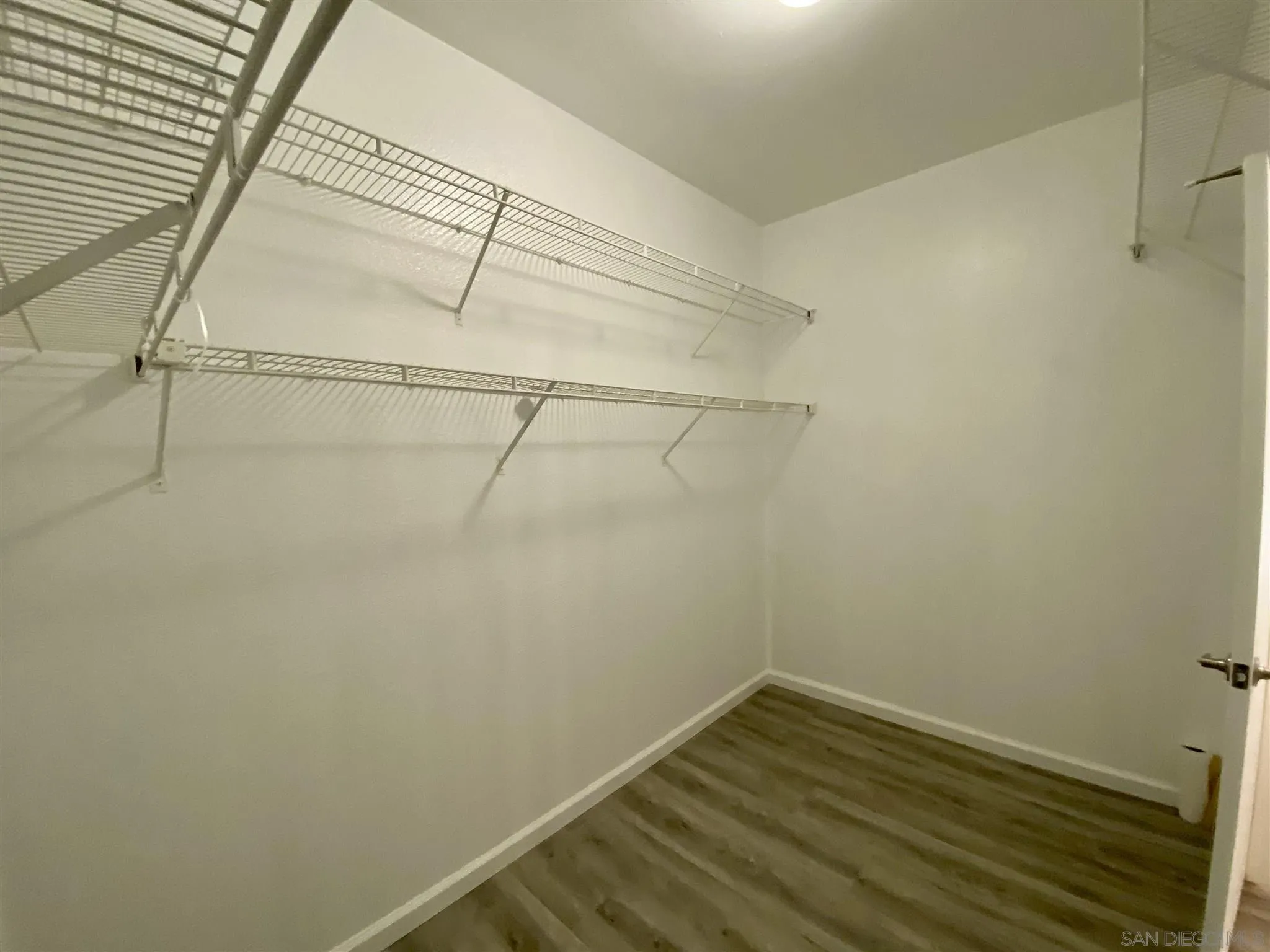 17161 Alva Road, Unit 213 San Diego, CA 92127 - Photo 21 of 48 a view of a room with racks on the wall