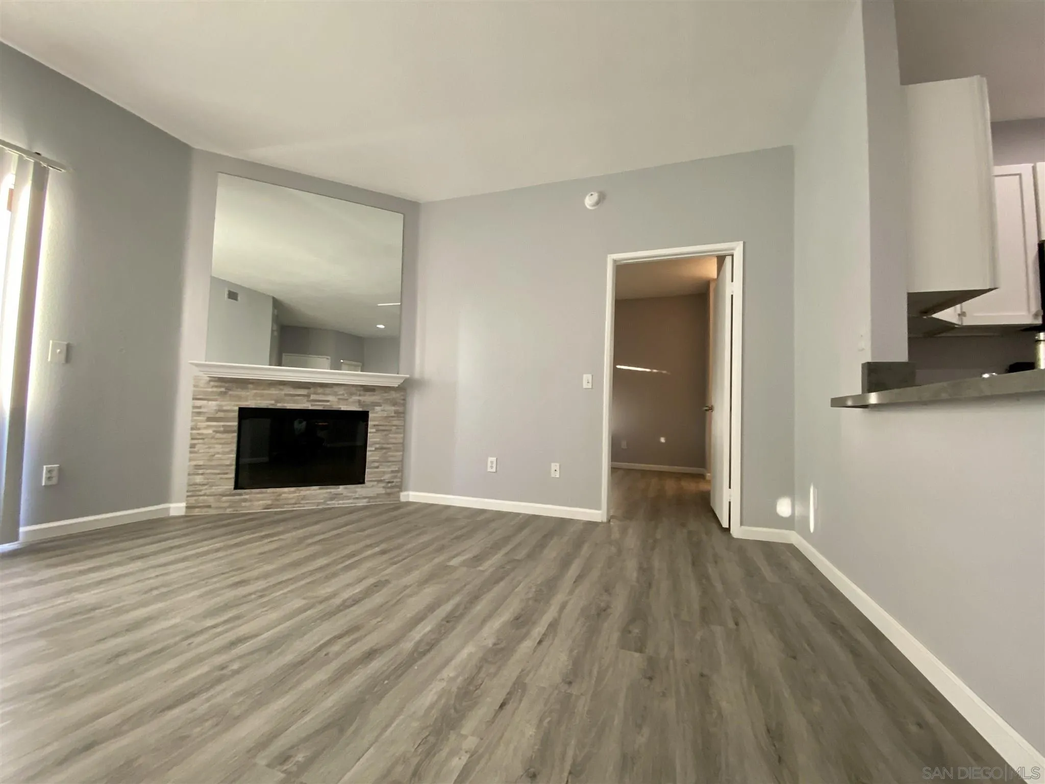 17161 Alva Road, Unit 213 San Diego, CA 92127 - Photo 31 of 48 wooden floor fireplace and natural light