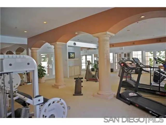 17161 Alva Road, Unit 213 San Diego, CA 92127 - Photo 36 of 48 a room with gym equipment and large mirror