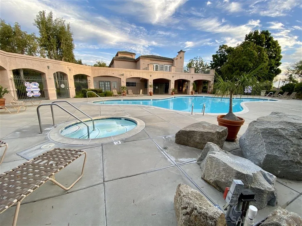 17161 Alva Road, Unit 213 San Diego, CA 92127 - Photo 37 of 48 a view of multiple house with swimming pool and porch