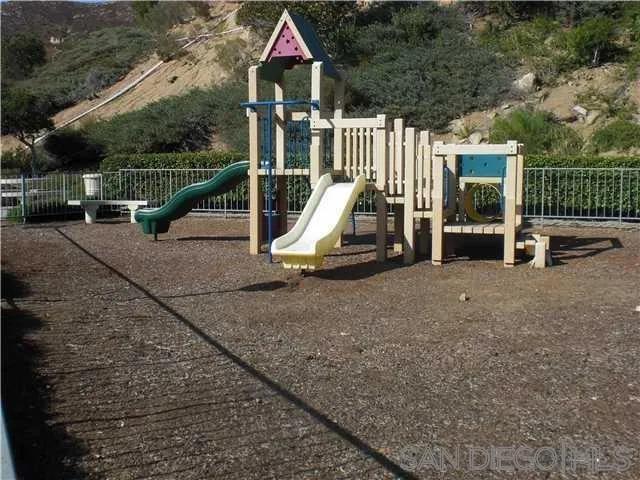 17161 Alva Road, Unit 213 San Diego, CA 92127 - Photo 45 of 48 a view of outdoor space yard deck and slide