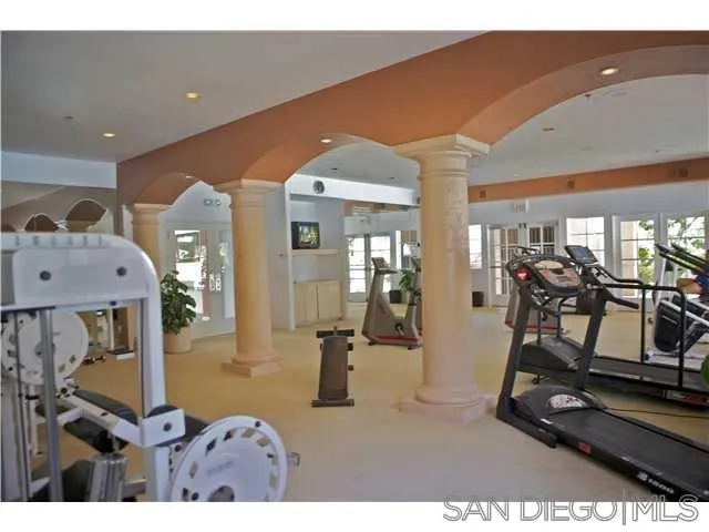 17161 Alva Road, Unit 213 San Diego, CA 92127 - Photo 47 of 48 a room with gym equipment and large mirror