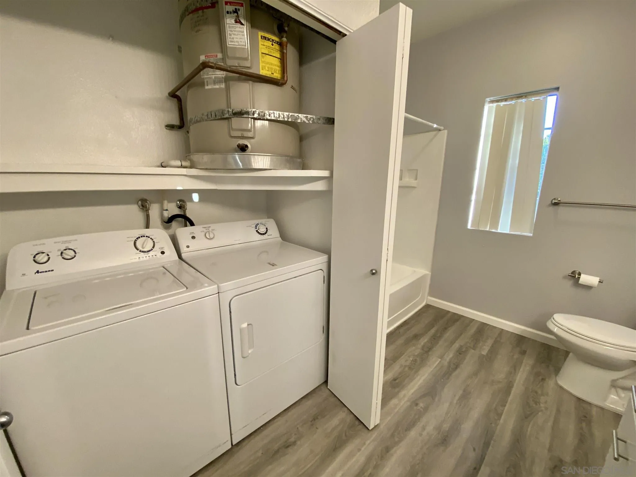 17161 Alva Road, Unit 213 San Diego, CA 92127 - Photo 5 of 48 a utility room with dryer and washer