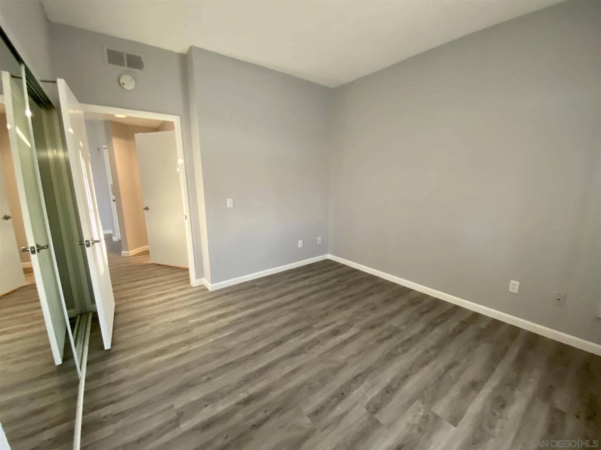 17161 Alva Road, Unit 213 San Diego, CA 92127 - Photo 6 of 48 a view of wooden floor in an empty room