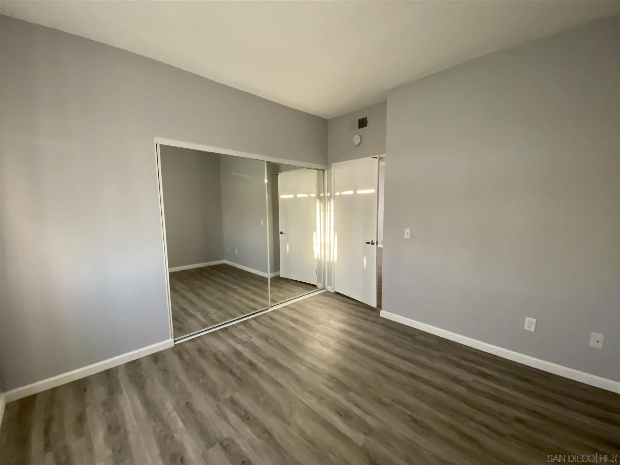 17161 Alva Road, Unit 213 San Diego, CA 92127 - Photo 8 of 48 wooden floor in an empty room