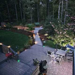 an aerial view of a house with yard swimming pool and outdoor seating