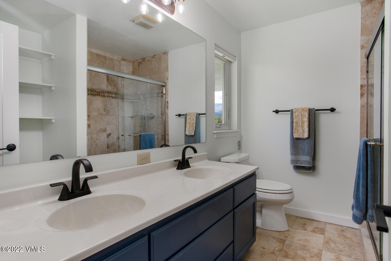 3 Canvas Back Eagle, CO 81631 - Photo 15 of 26 a bathroom with a double vanity sink toilet and shower