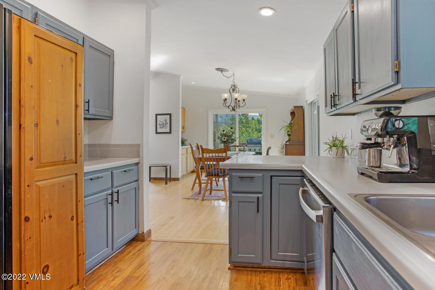 3 Canvas Back Eagle, CO 81631 - Photo 9 of 26 a kitchen with kitchen island granite countertop a sink cabinets and wooden floor