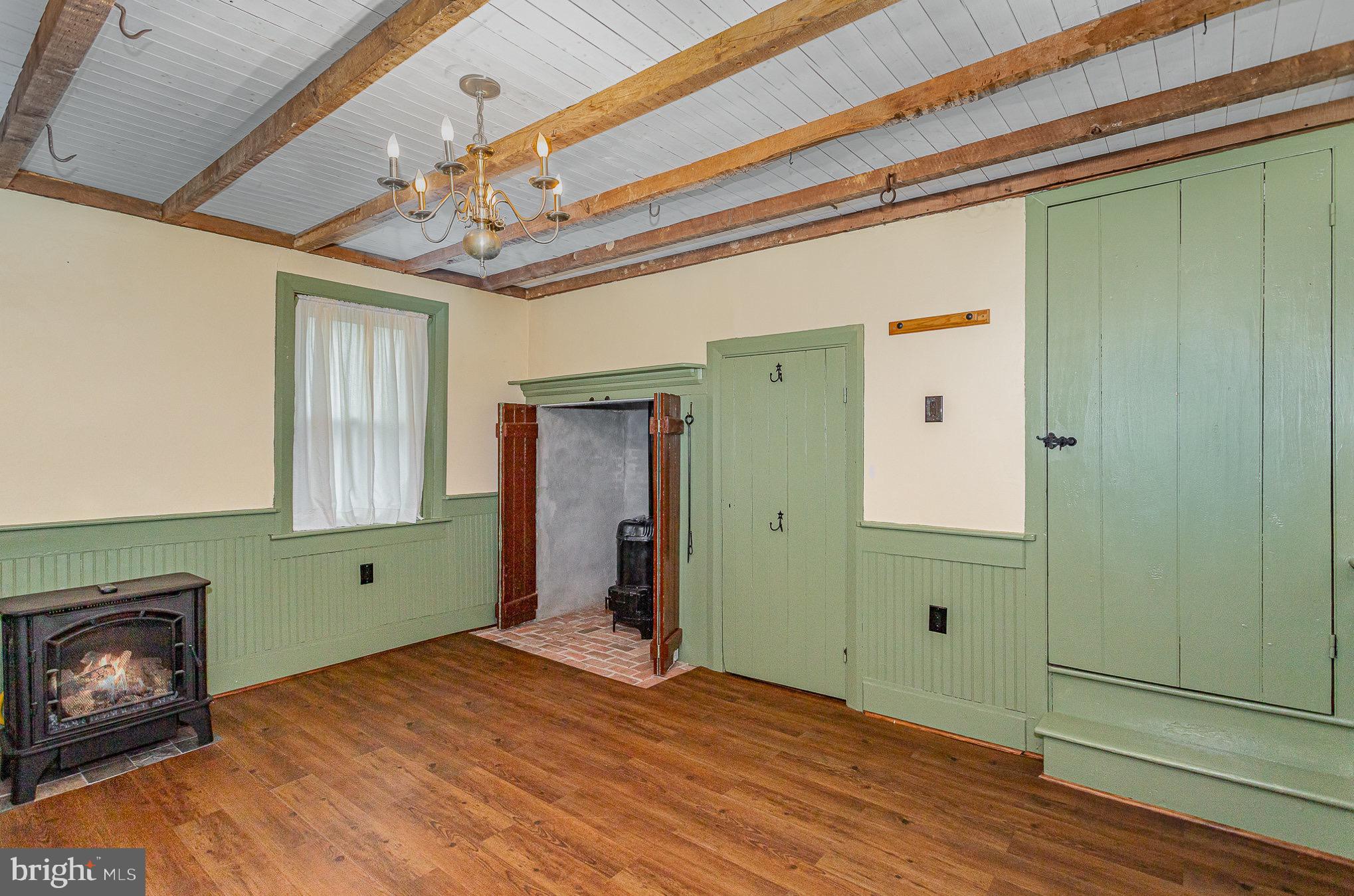 407 East Derry Road Hershey, PA 17033 - Photo 16 of 48 a view of an empty room with a fireplace and a window