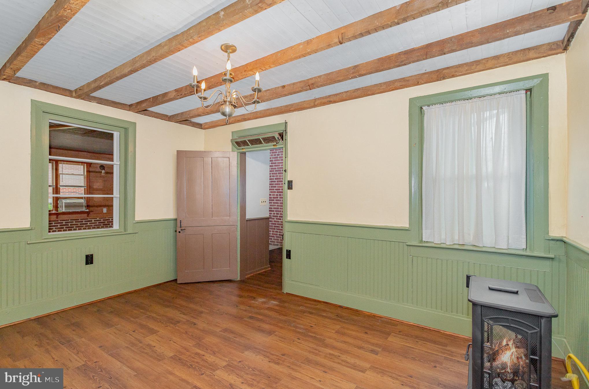 407 East Derry Road Hershey, PA 17033 - Photo 17 of 48 a view of a room that has a window and wooden floor