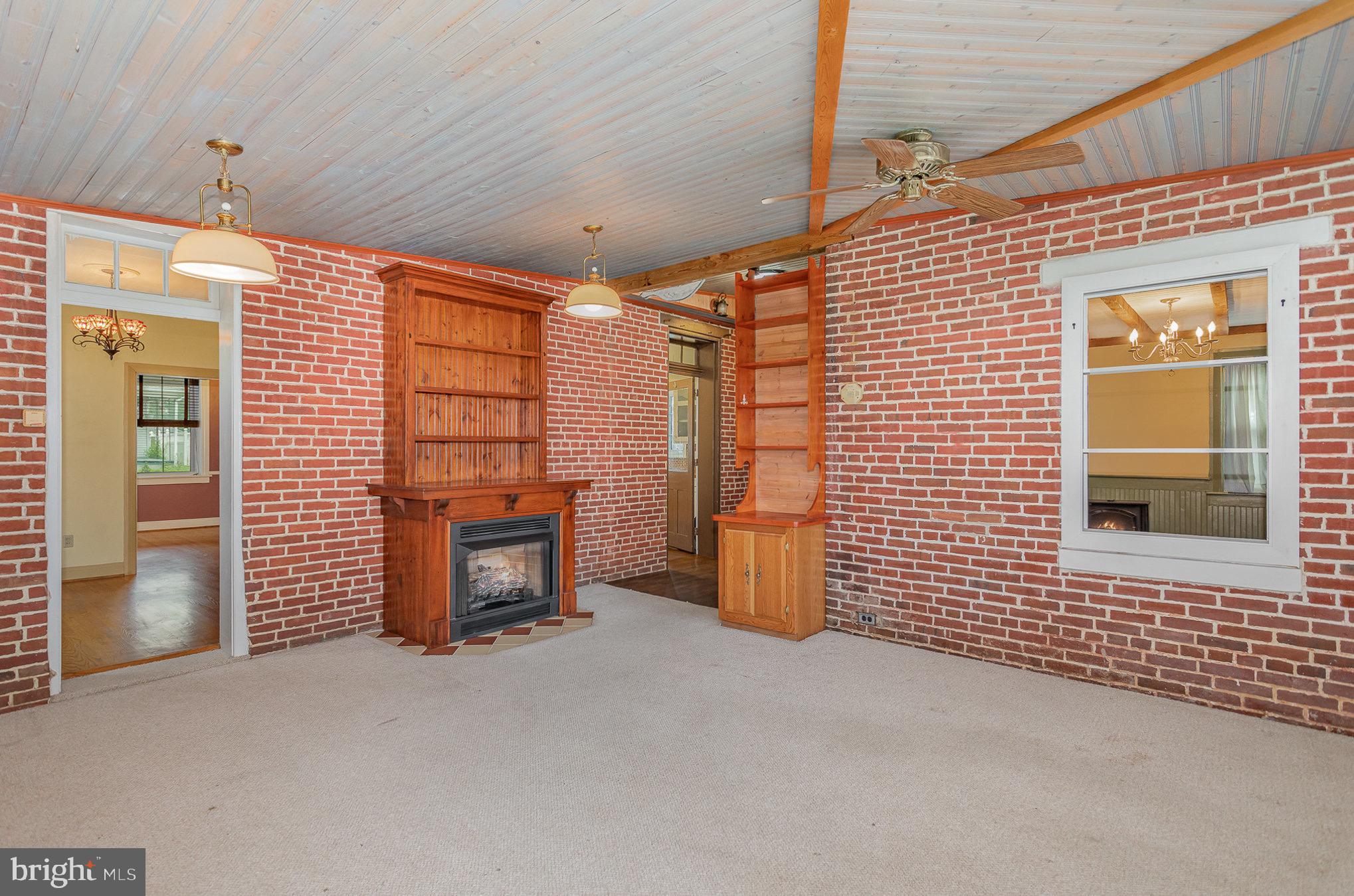 407 East Derry Road Hershey, PA 17033 - Photo 19 of 48 a view of a livingroom with a chair and a fireplace