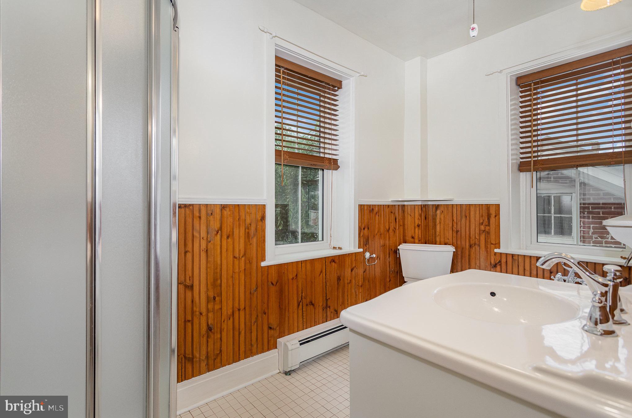 407 East Derry Road Hershey, PA 17033 - Photo 24 of 48 a bathroom with a sink a mirror and a window