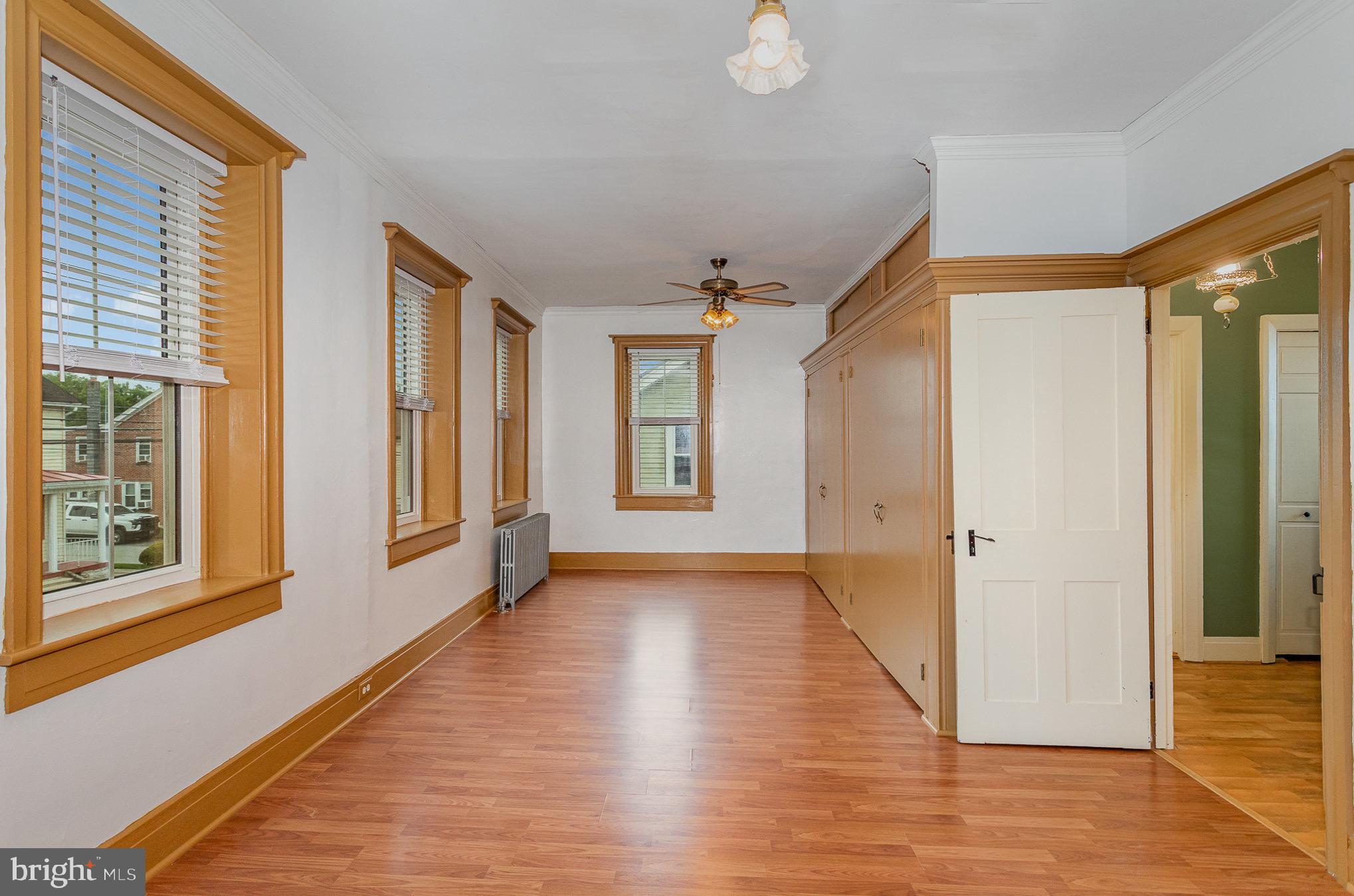 407 East Derry Road Hershey, PA 17033 - Photo 26 of 48 a view of an empty room with glass door and wooden floor