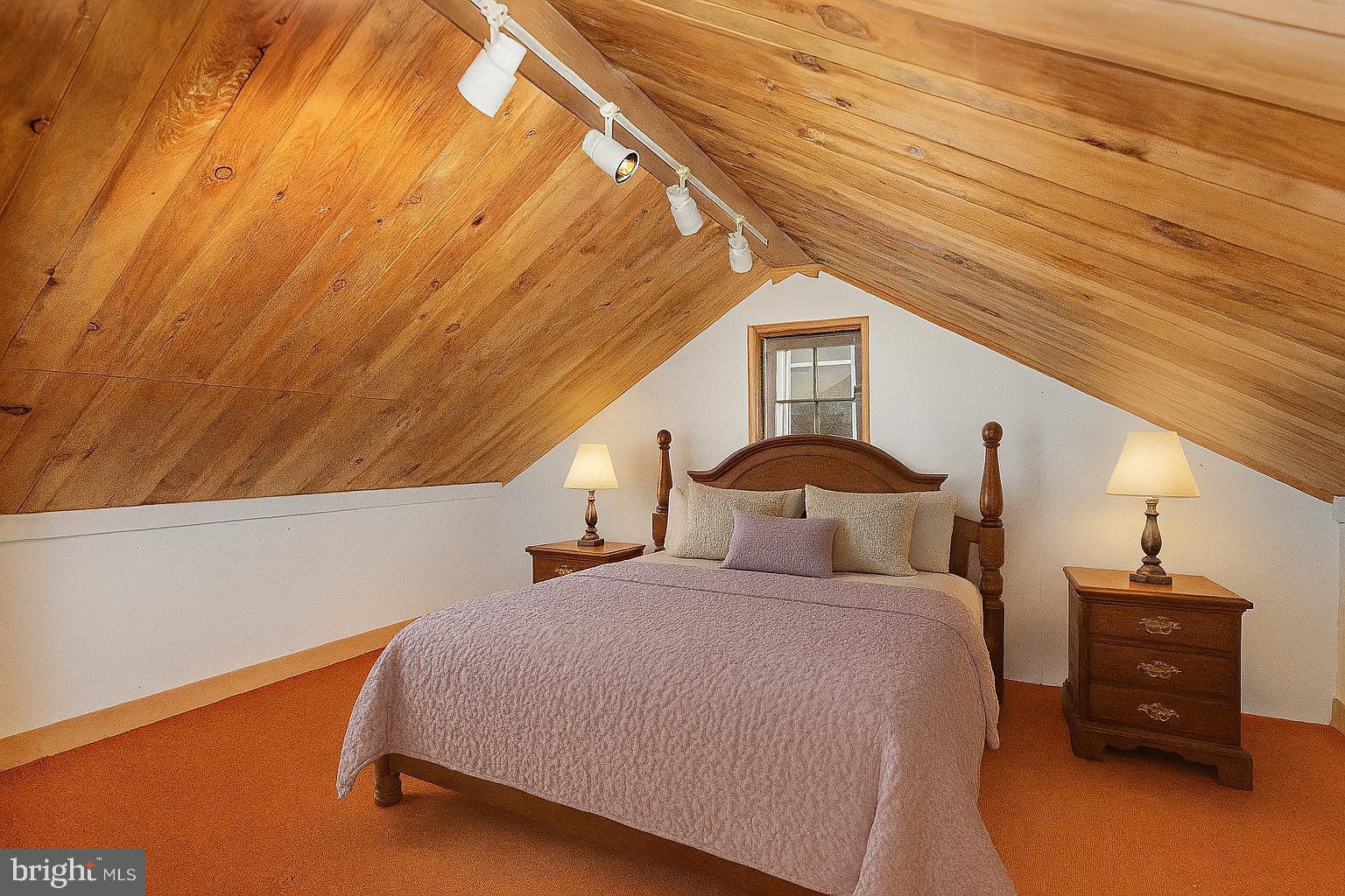 407 East Derry Road Hershey, PA 17033 - Photo 29 of 48 a bedroom with a bed and a lamp on the dresser