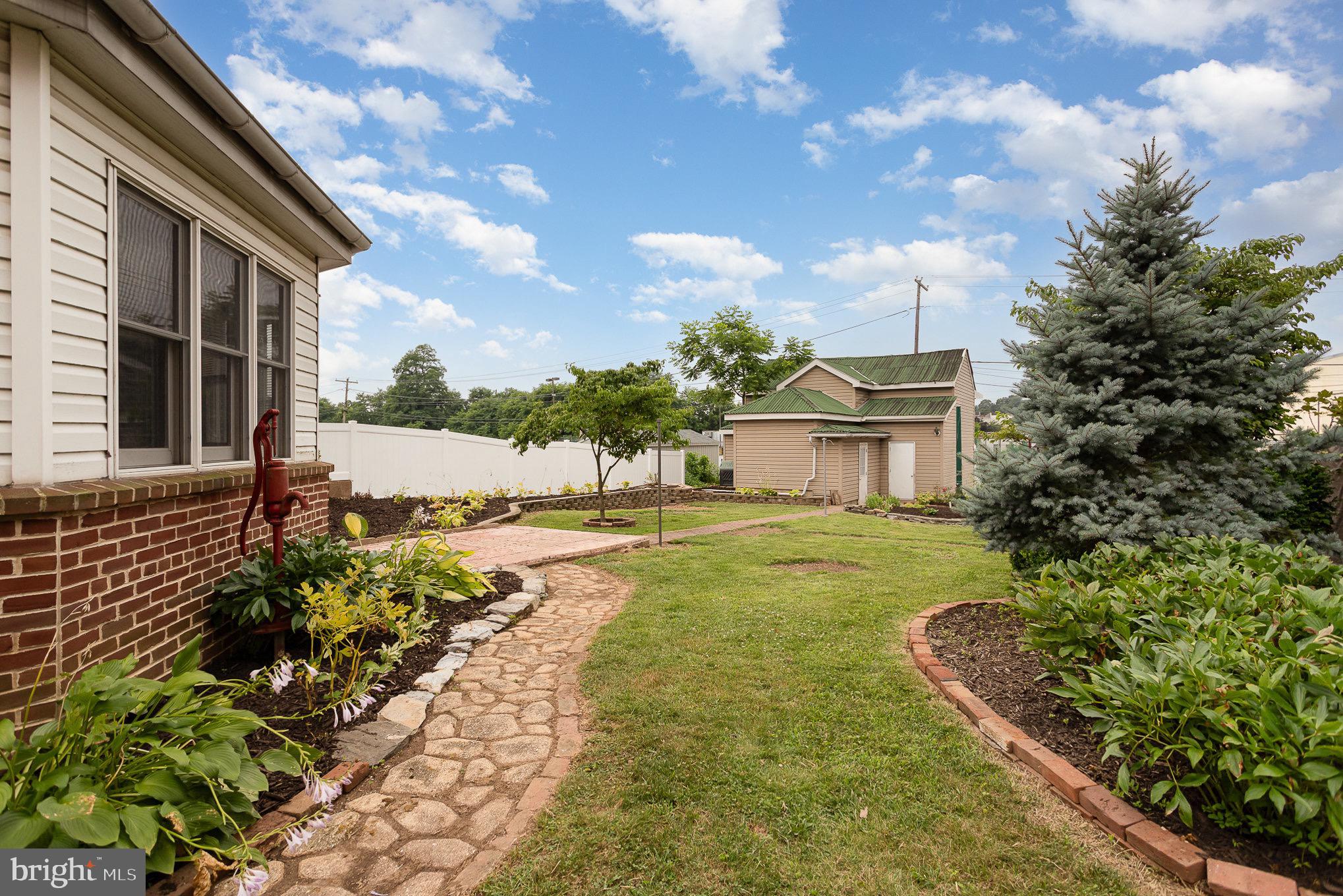 407 East Derry Road Hershey, PA 17033 - Photo 36 of 48 a view of a house with a yard