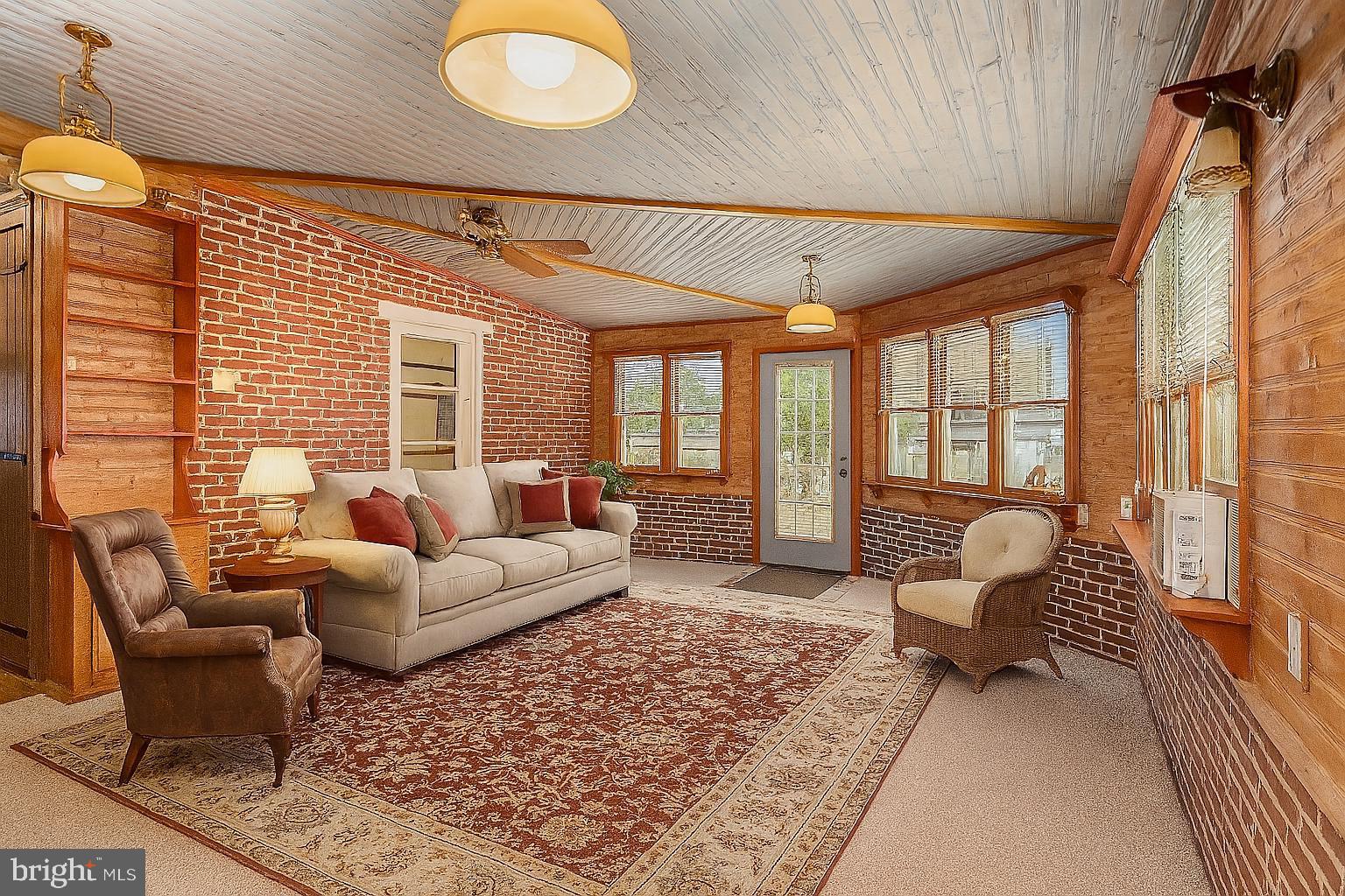 407 East Derry Road Hershey, PA 17033 - Photo 5 of 48 a living room with furniture and a large window