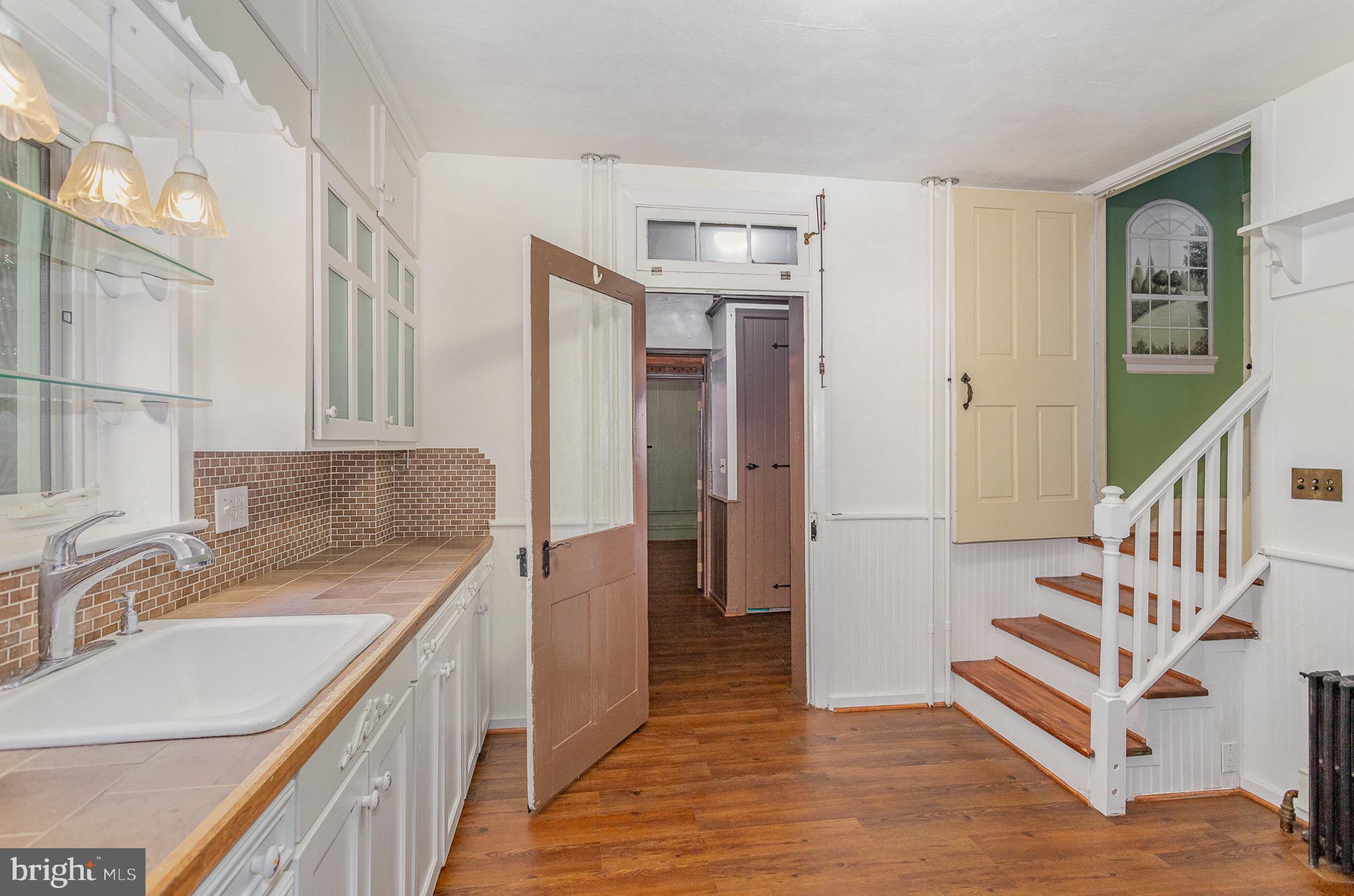 407 East Derry Road Hershey, PA 17033 - Photo 8 of 48 a bathroom with a sink a mirror and a shower