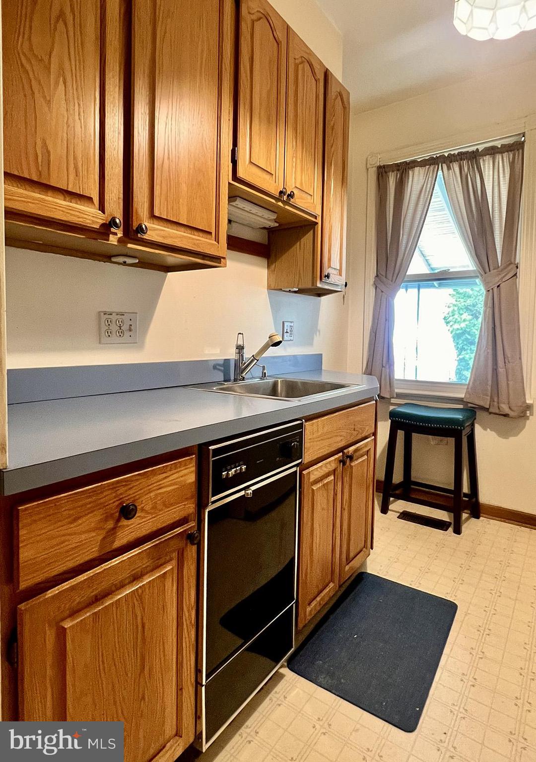 349 Chestnut Street West Reading, PA 19611 - Photo 12 of 23 a kitchen with stainless steel appliances granite countertop a sink a stove and a microwave