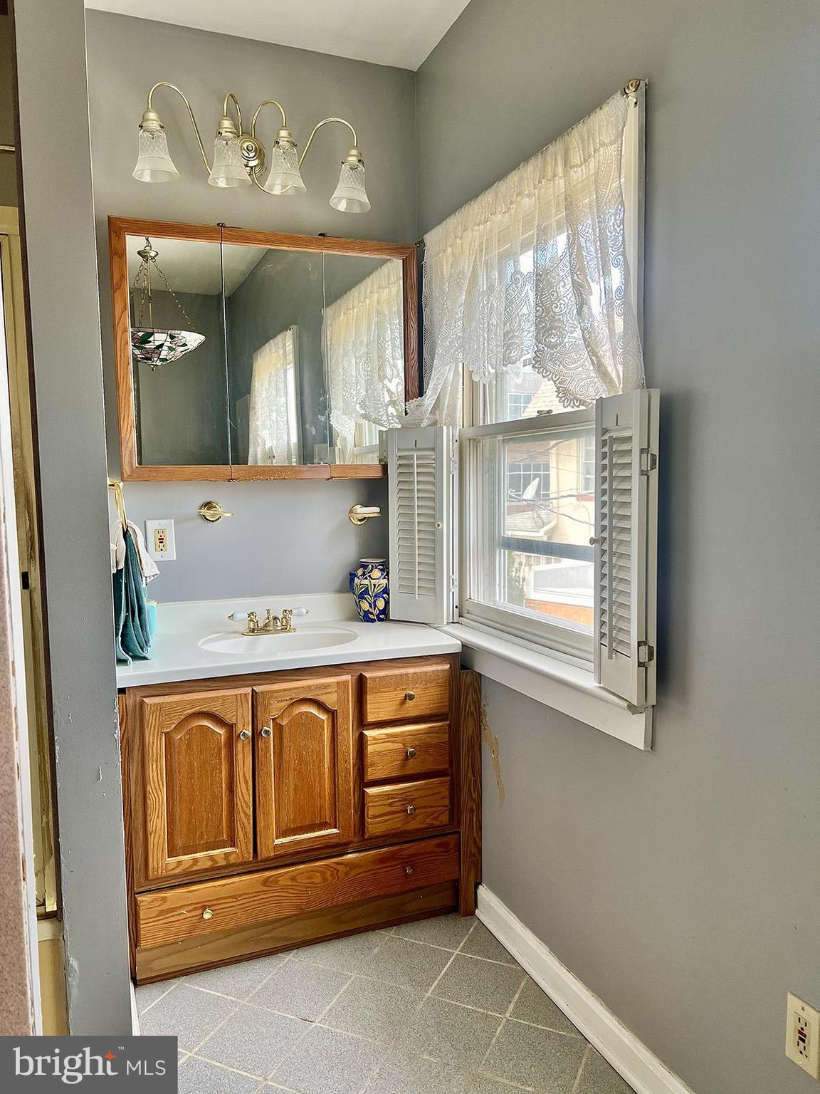 349 Chestnut Street West Reading, PA 19611 - Photo 17 of 23 a bathroom with a sink and a mirror