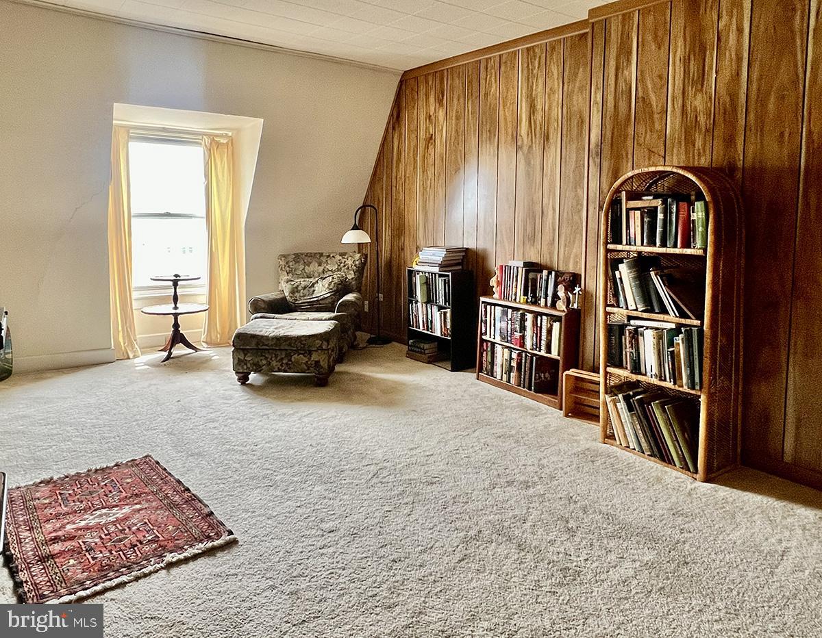 349 Chestnut Street West Reading, PA 19611 - Photo 19 of 23 a bedroom with furniture and a book shelf