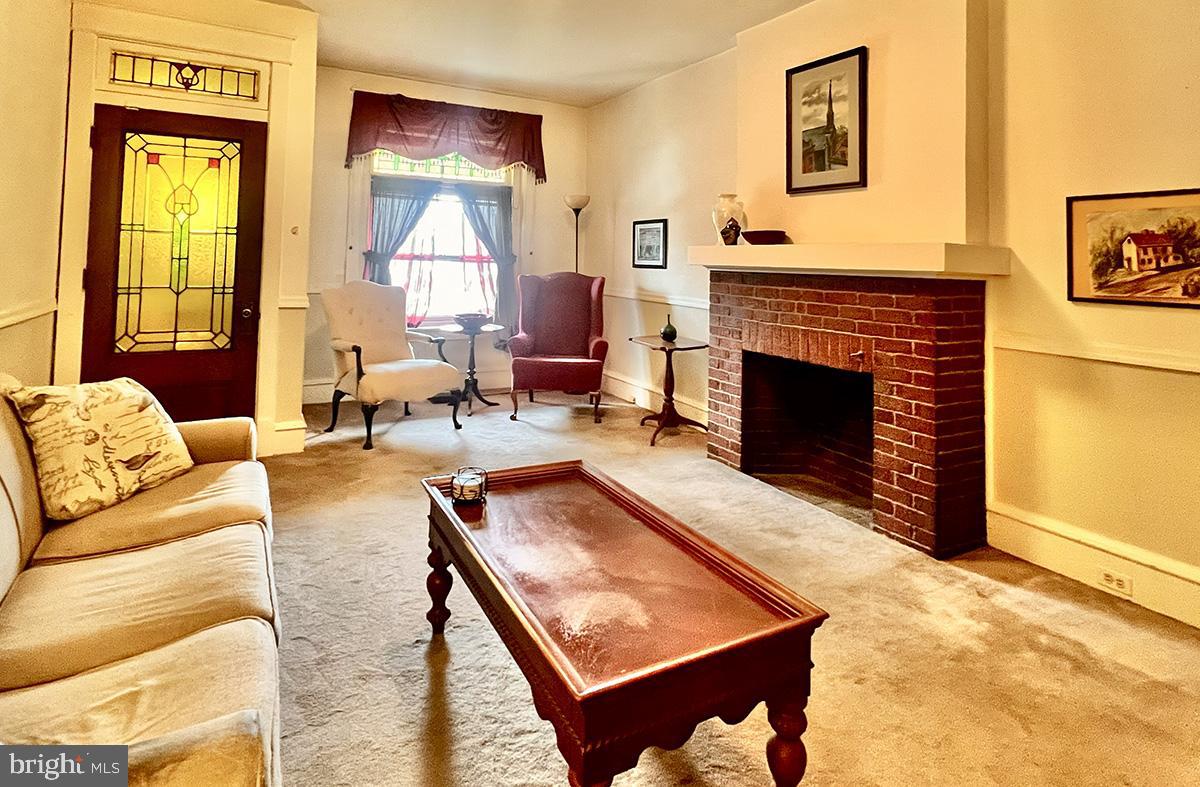 349 Chestnut Street West Reading, PA 19611 - Photo 3 of 23 a living room with furniture and a fireplace