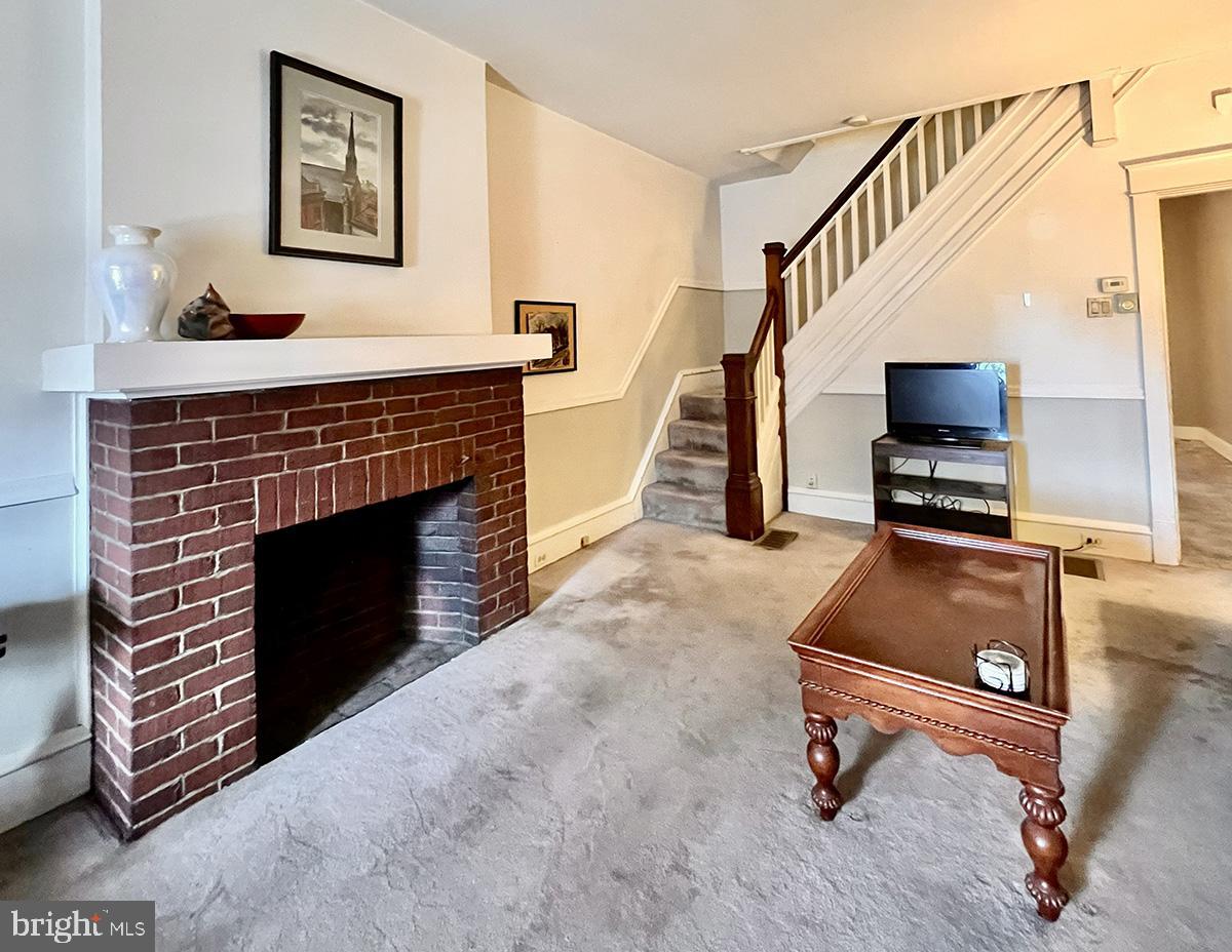 349 Chestnut Street West Reading, PA 19611 - Photo 7 of 23 a living room with furniture and a fireplace