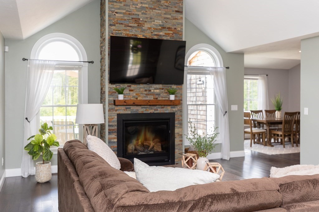 7 Pond Edge Trail Wareham, MA 02571 - Photo 12 of 30 a living room with furniture a fireplace and a flat screen tv