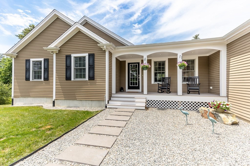 7 Pond Edge Trail Wareham, MA 02571 - Photo 2 of 30 a front view of a house with a yard